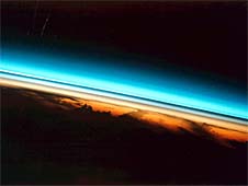 This photograph of the colorful layers of Earth's upper atmosphere was taken from the space shuttle, looking sideways across Earth's atmosphere. Image Credit: NASA